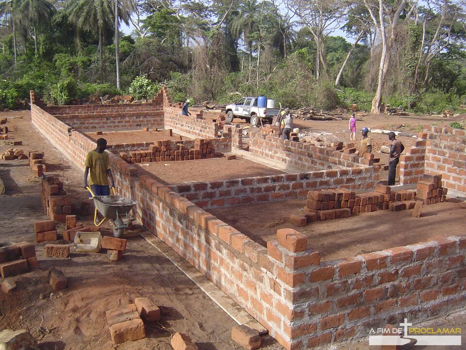 Brick walls of the school under construction, in the middle of the bush