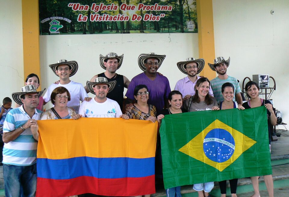 Brazilian and Colombian team with the flags of both countries