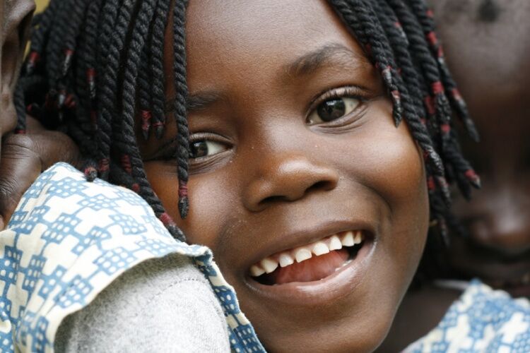 Girl smiling in Iemberém, Guinea-Bissau